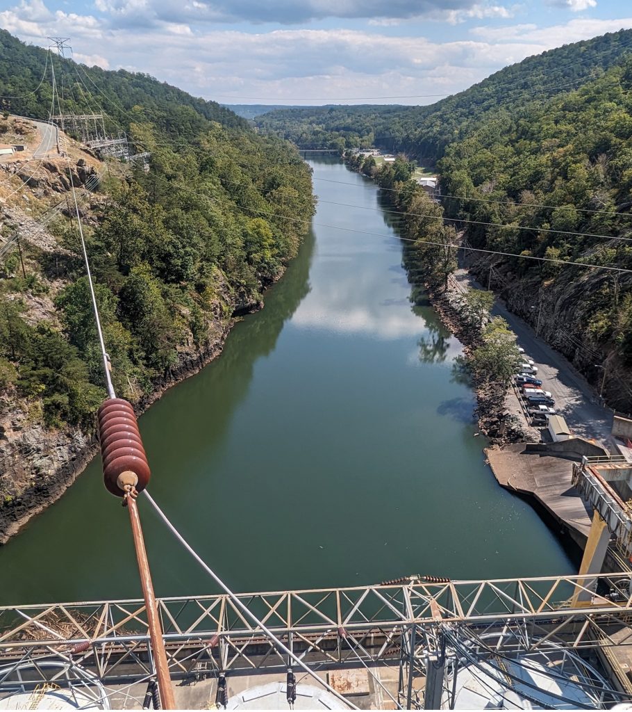 Looking downstream from the crest of a 300 foot tall hydroelectric dam in the Appalachian mountains on the east coast of the United States. Photo taken by Eleanor Bloom geotechnical hydro engineer with Merjent, Inc.